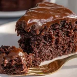 Gluten free chocolate zucchini cake slice with fudge frosting