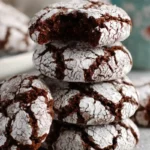 Gluten-free chocolate crinkle cookies with crackled powdered sugar.