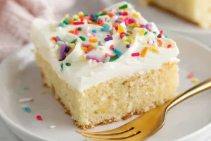 gluten free dairy free vanilla cake sliced on a plate