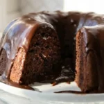 Gluten-Free Chocolate Bundt Cake with chocolate glaze on cake stand